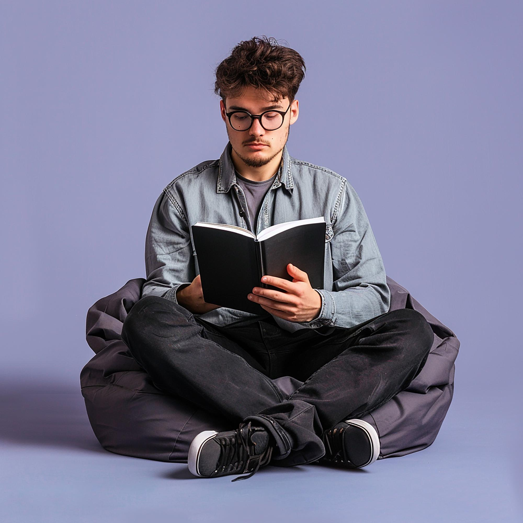 Person reading a book instead of using a phone